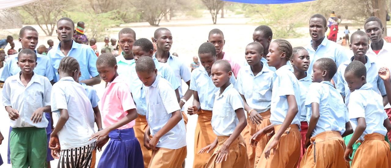A group of dancers in Turkana County, Kenya, perform at a launch ceremony for the WASH-FIN project. Photo credit: USAID/Kenya A group of dancers in Turkana County, Kenya, perform at a launch ceremony for the WASH-FIN project. Photo credit: USAID/Kenya