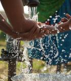 A woman washes her hands in Nepal's Binauna village.