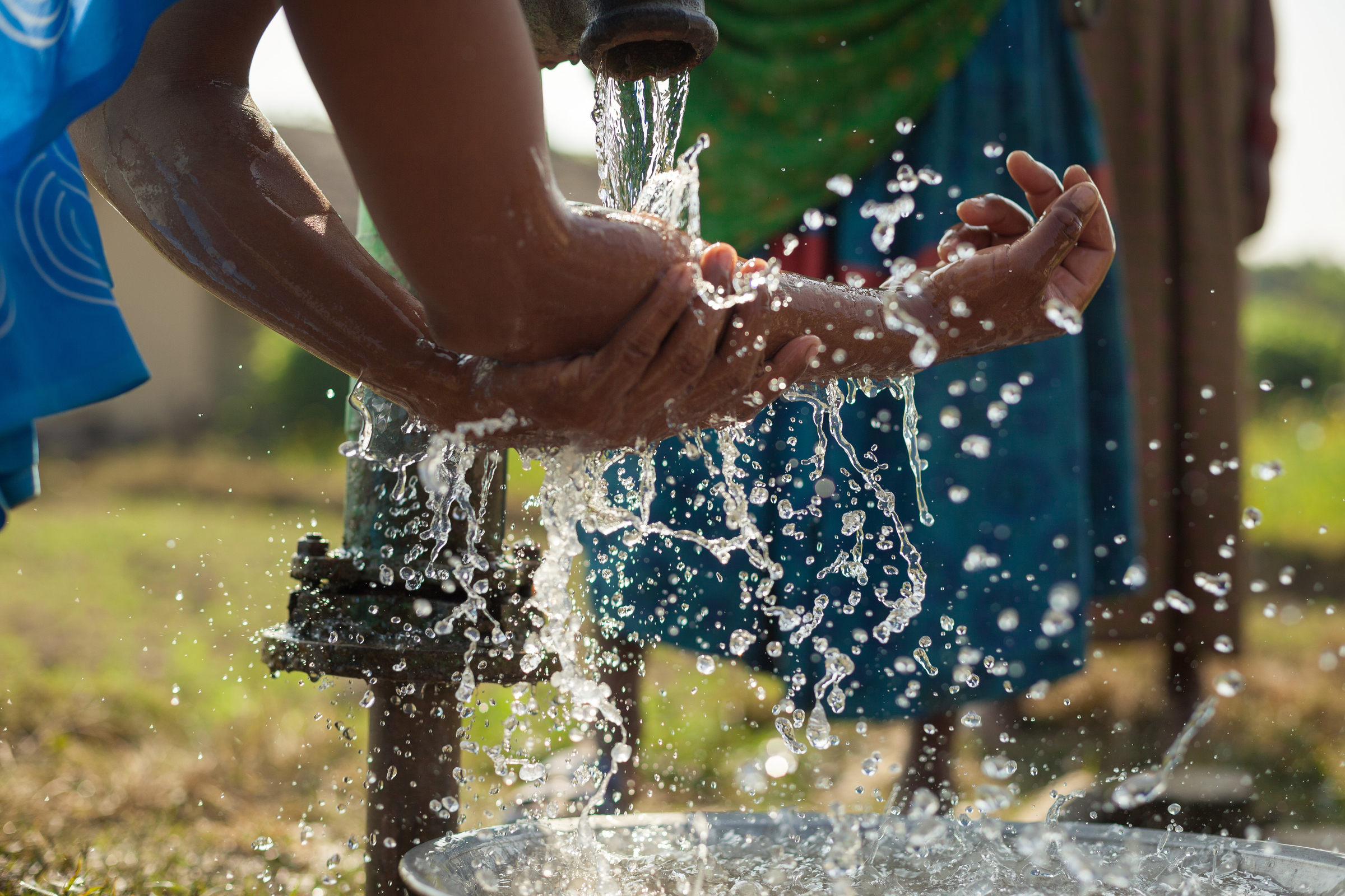 A woman washes her hands in Nepal's Binauna village.