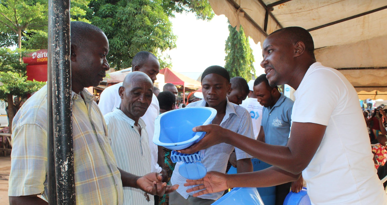 A community in Tanzania learns about SATO latrine pans. Photo credit: USAID/Tanzania
