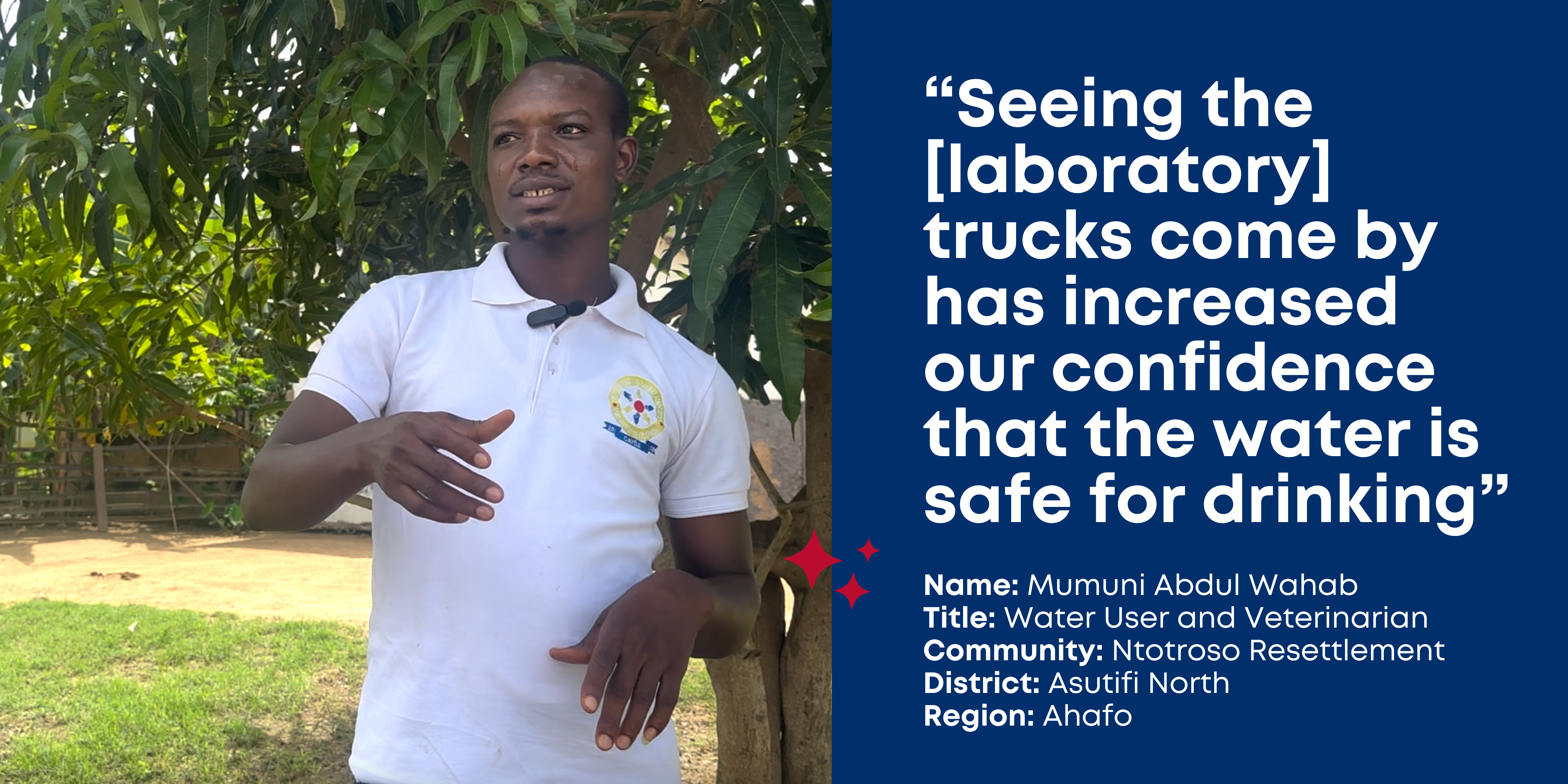 Mumuni Abdul Wahab, a veterinarian, stands under a tree wearing a white polo shirt and gestures with his hands. "Seeing the [laboratory] trucks come by has increased confidence that water is safe for drinking." Asutifi North, Ahafo, Ghana