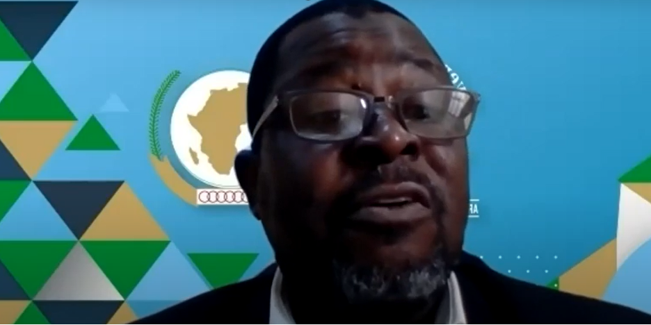 A screenshot of Moshood N. Tijani speaking with the AMCOW logo in the background