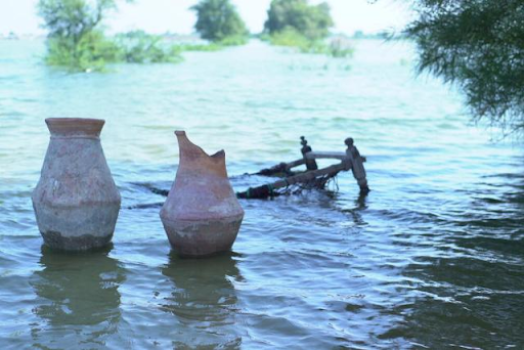 Two urns sit in a river