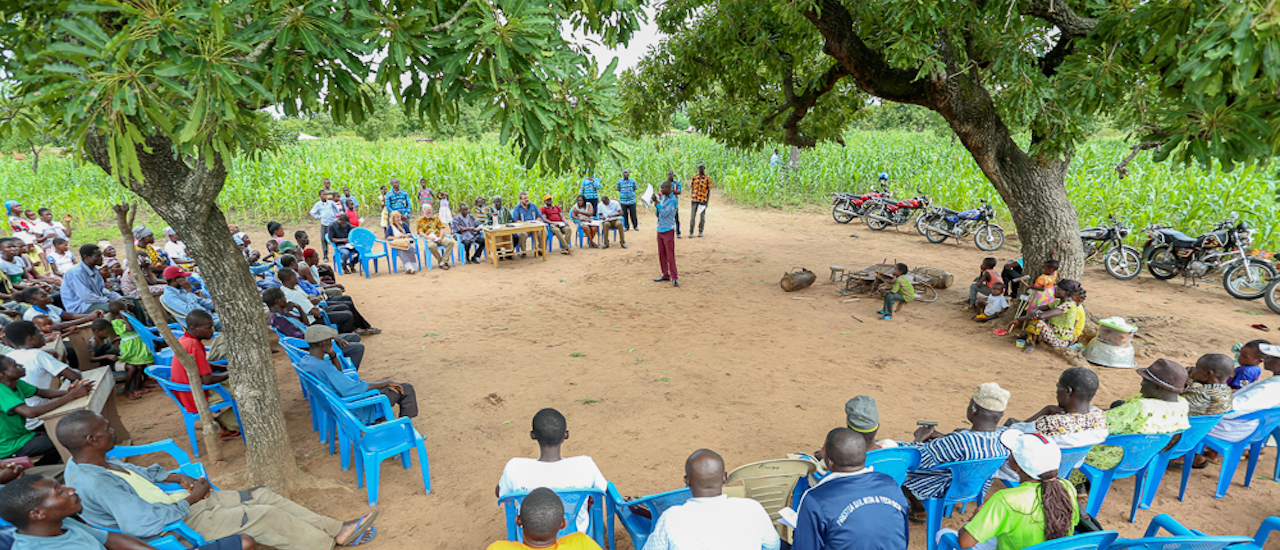 A community gathers to discuss sanitation improvements in Ghana. Photo Credit: USAID/Ghana