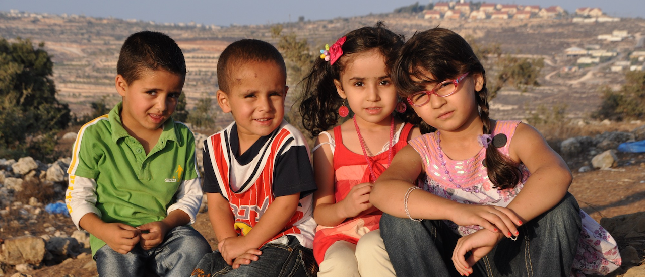 Children from Halhul, one of the many cities and communities in the southern West Bank’s Hebron Governor- ate now experiencing improved water security thanks to the new USAID-funded Deir Sha’ar Pipeline, which  began operations in late 2015. Photo credit: Izzeddeen Alkarajeh