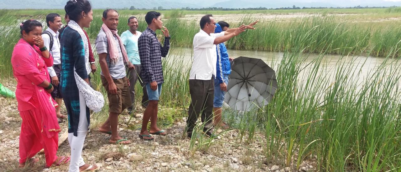 Pateshwori Chaudary (right) and other community stakeholders inspect some of their fishing areas on the Rapti River. Photo credit: Ram Moti Chaudhary/HWEPC