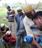 Residents of Wita, a small rural community three hours south of Addis Ababa, Ethiopia’s capital, examine infrastructure that will be used to improve the reliability of their water supply. Photo credit: Triple Bottom Line (3BL) Enterprises