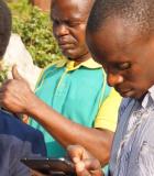 Data technicians in the Manica Province of Mozambique at a training to learn how to use the new m-SINAS tablets for mobile data collection. Photo credit: IWED Mozambique/ENGIRDO